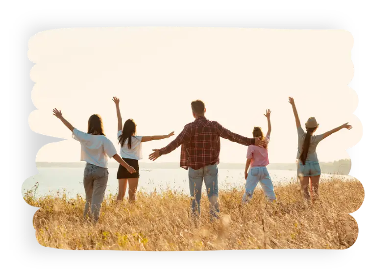 family frolicking in fields